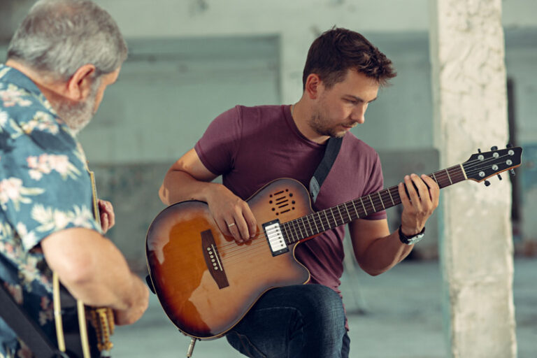 Repetition of rock music band. Electric guitar players