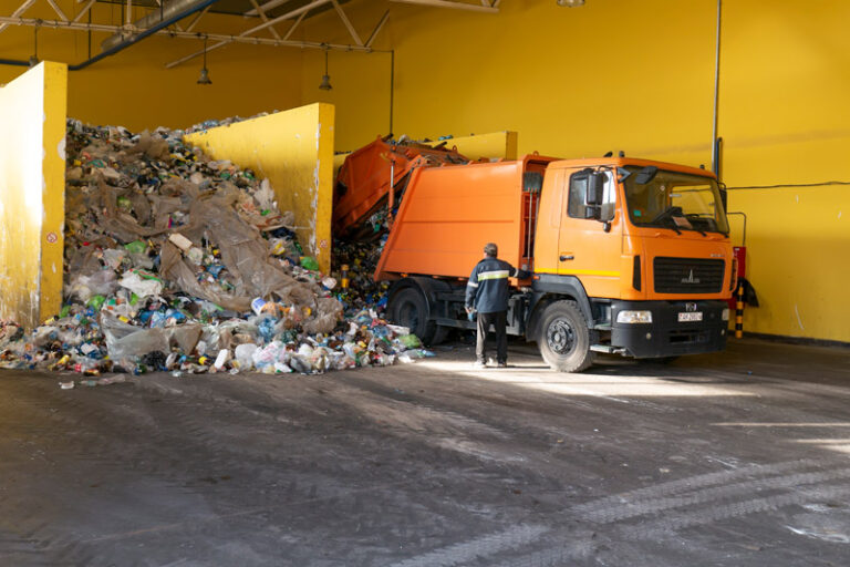 GRODNO, BELARUS - OCTOBER 26, 2019: Garbage truck unloads garbag